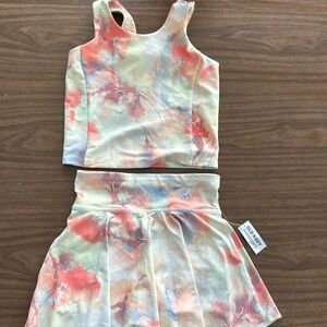 NWT set Old Navy powersoft top and skort. Bottoms have tag. Top is NWOT.